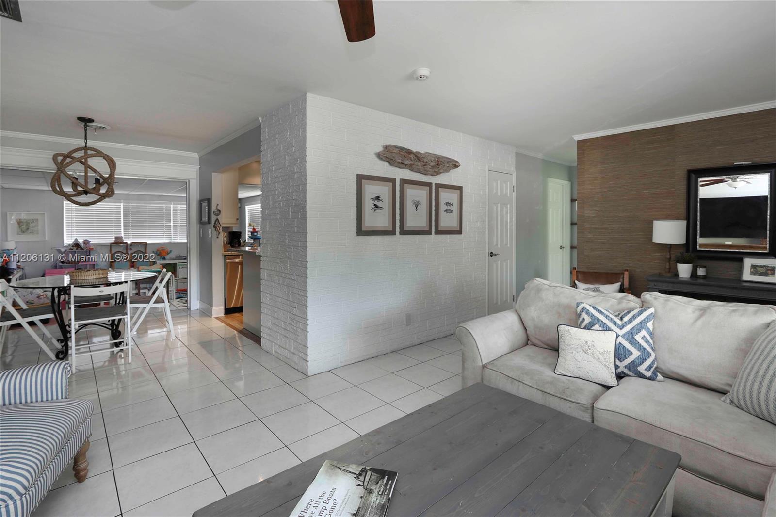 1711 North Park Road Hollywood, FL 33021 - Photo 6 of 29 a living room with furniture and a flat screen tv