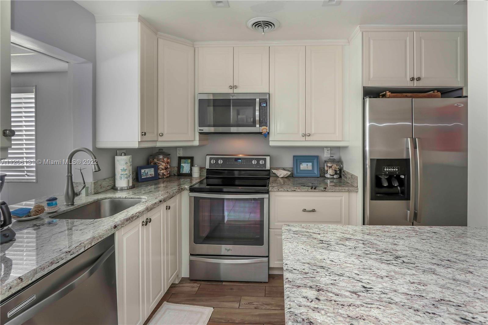 1711 North Park Road Hollywood, FL 33021 - Photo 7 of 29 a kitchen with a sink stove and refrigerator