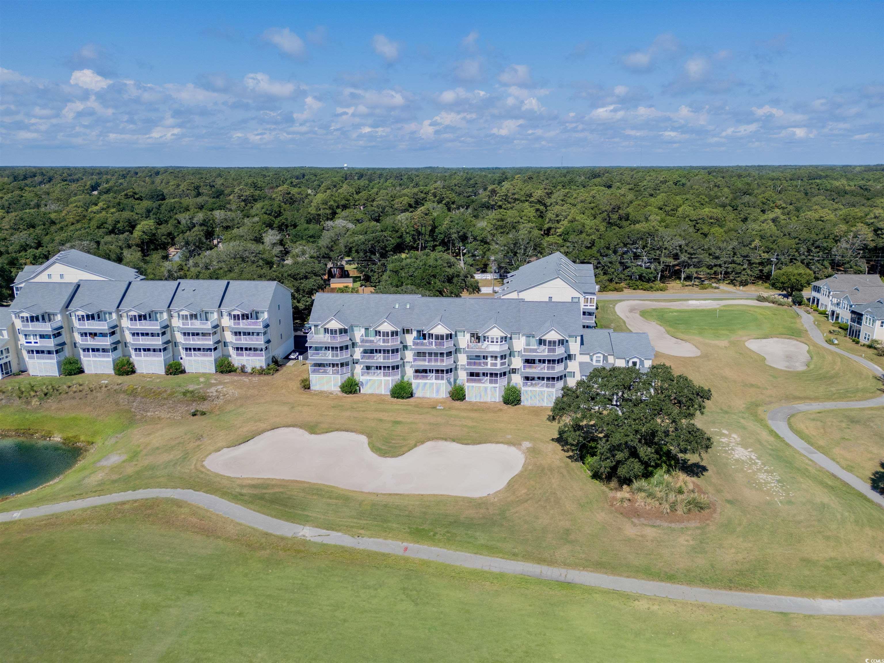 1912 Goose Creek Road Southwest, Unit 4301 Ocean Isle Beach, NC 28469 - Photo 34 of 39 Bird's eye view of a local golf course