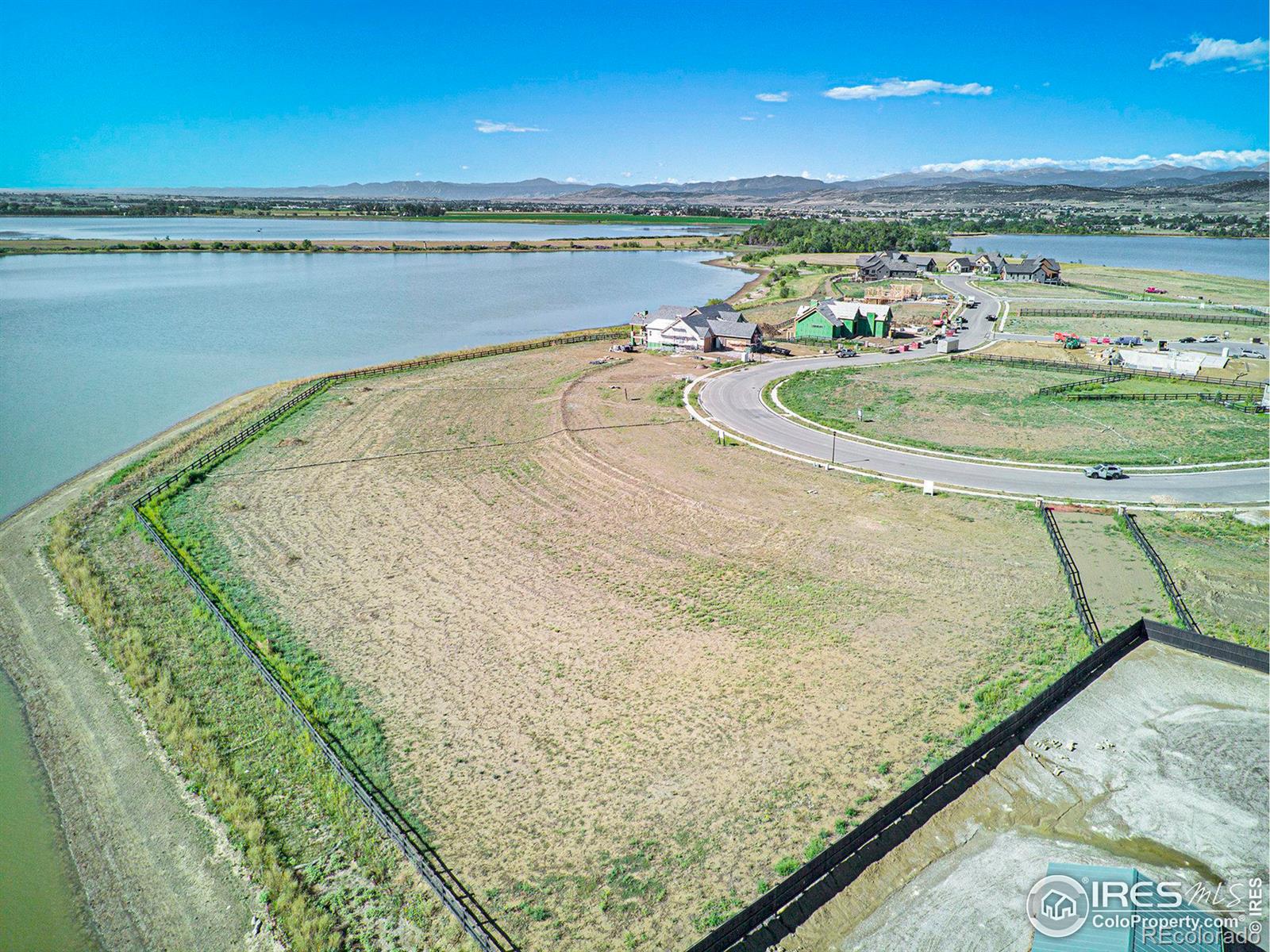 2664 Southwind Road Berthoud, CO 80513 - Photo 30 of 39 a view of a lake and a yard