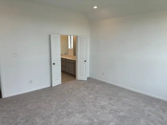 a view of an empty room and fire place