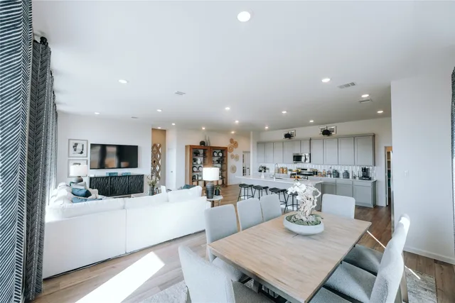 a view of a livingroom with furniture window and wooden floor