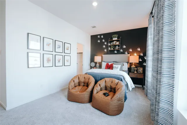 a bathroom with a sink a toilet a mirror and shower