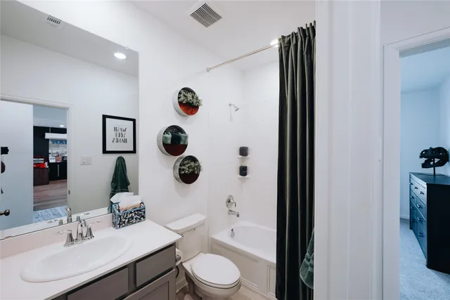 a bed room with a bed and a potted plant