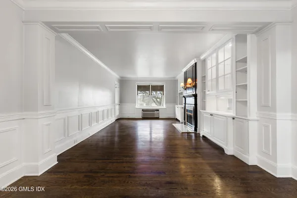 a kitchen with stainless steel appliances white cabinets and a stove top oven