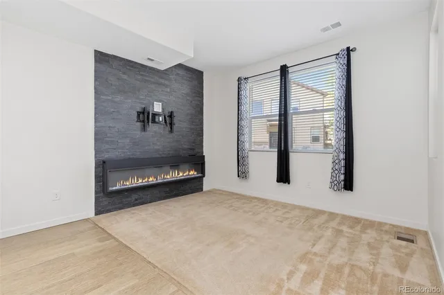 a view of a room with large windows