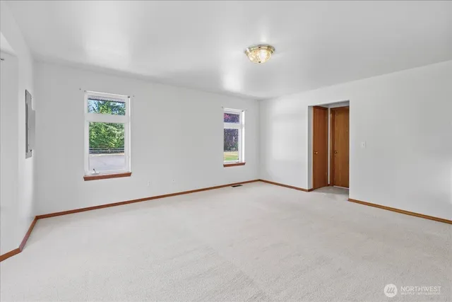 an empty room with windows