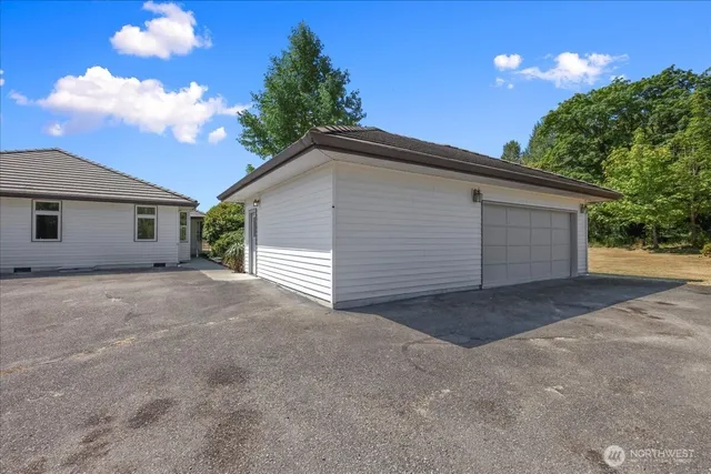a view of garage and yard