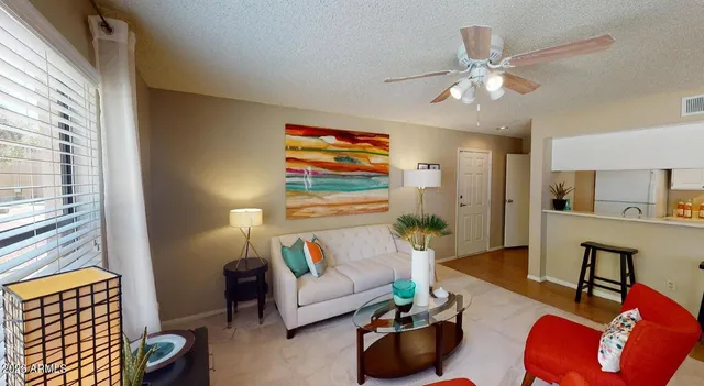 a living room with furniture and a window