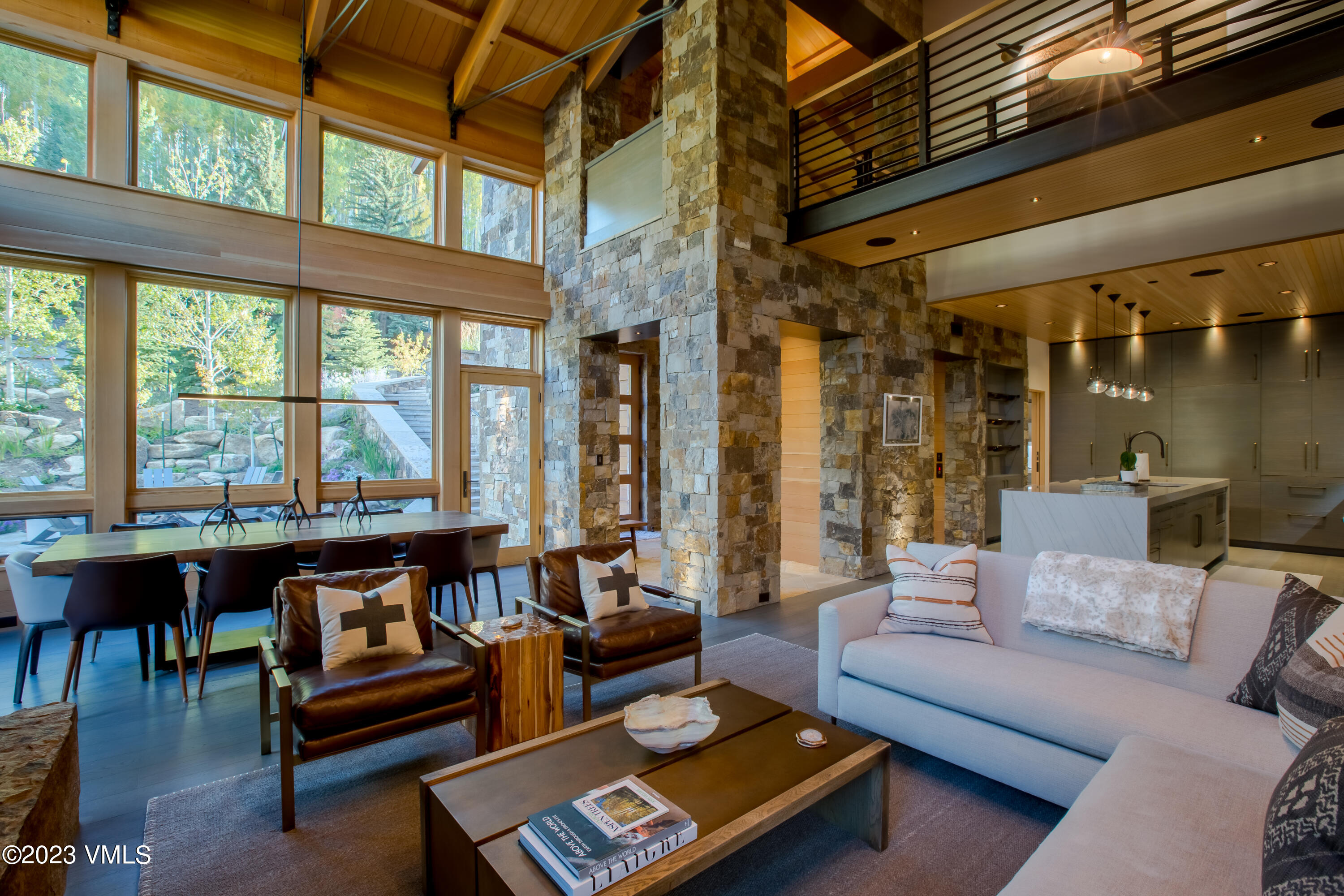 a living room with furniture and a floor to ceiling window