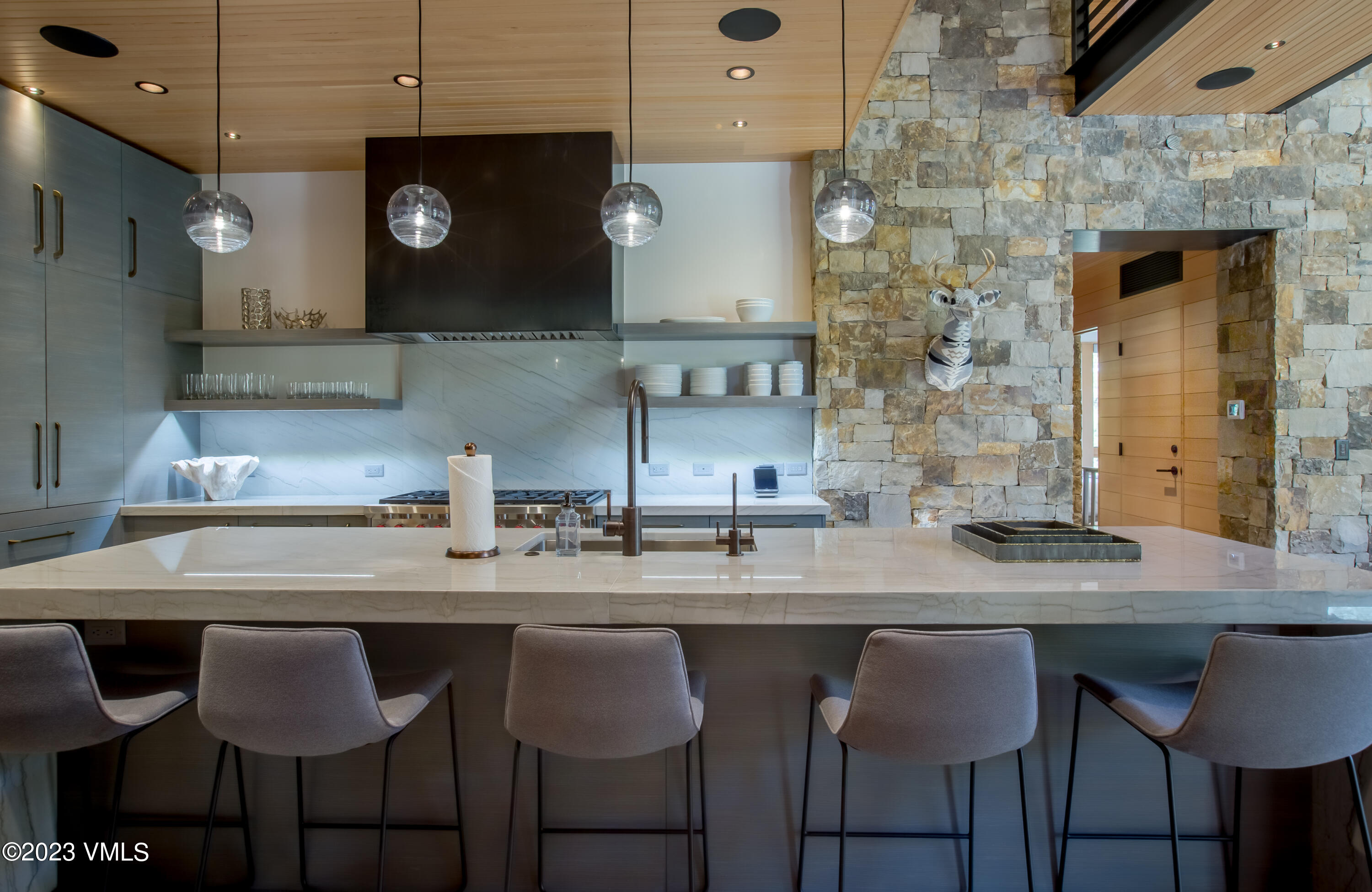 645 West Forest Road Vail, CO 81657 - Photo 13 of 48 a kitchen with a table and chairs in it