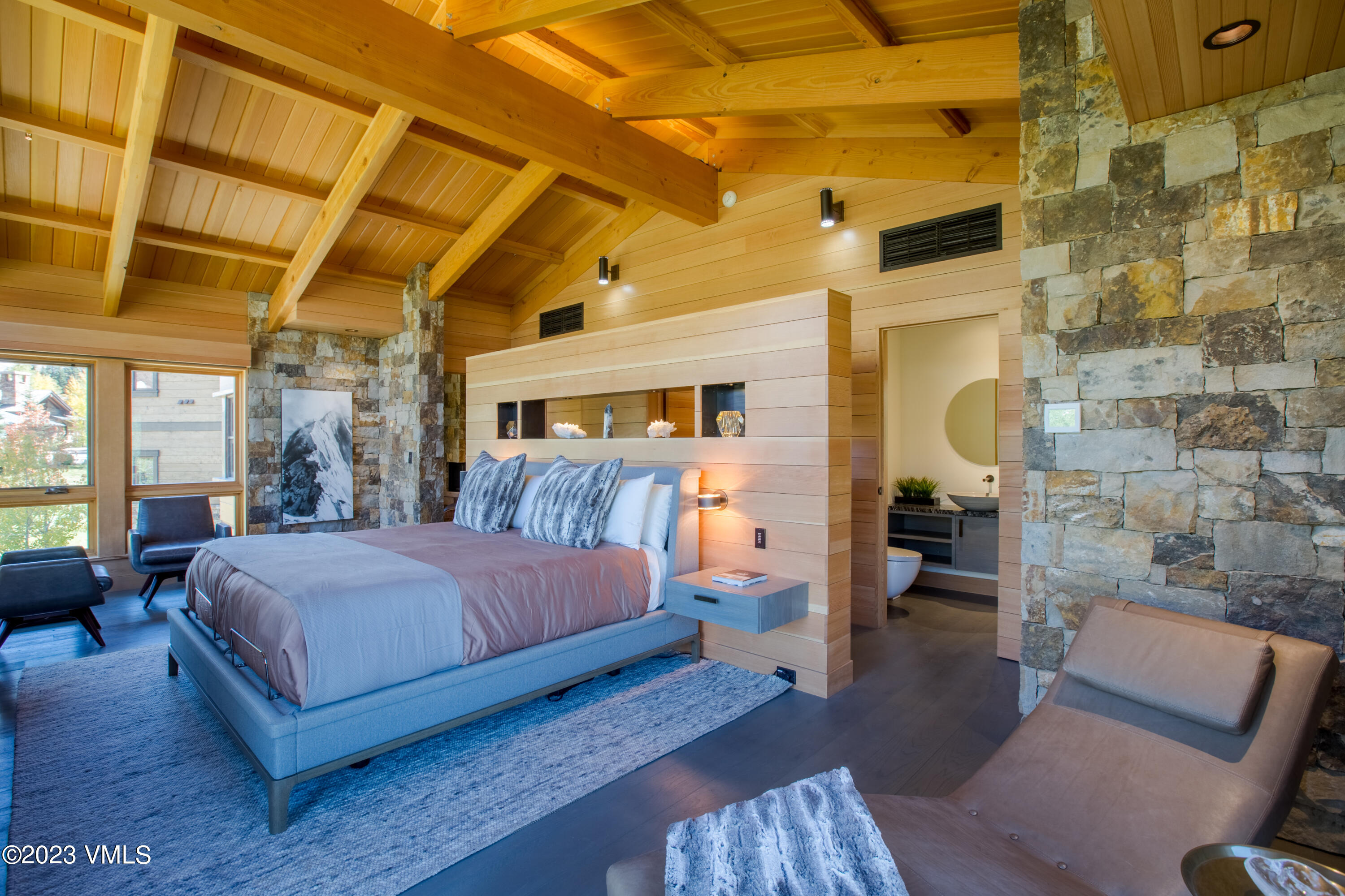 645 West Forest Road Vail, CO 81657 - Photo 23 of 48 a bedroom with a bed and wooden floor