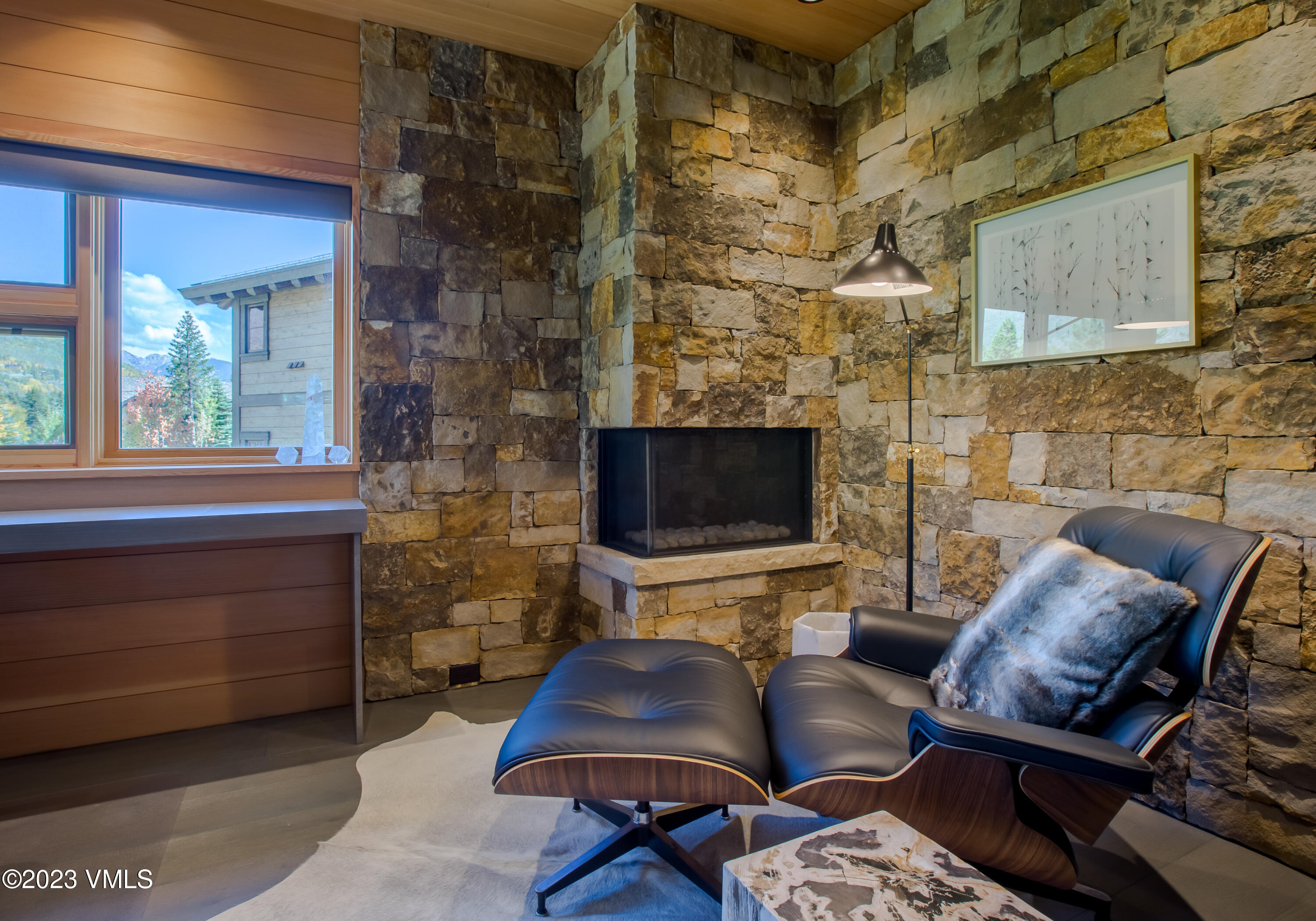 645 West Forest Road Vail, CO 81657 - Photo 26 of 48 a living room with furniture and a flat screen tv