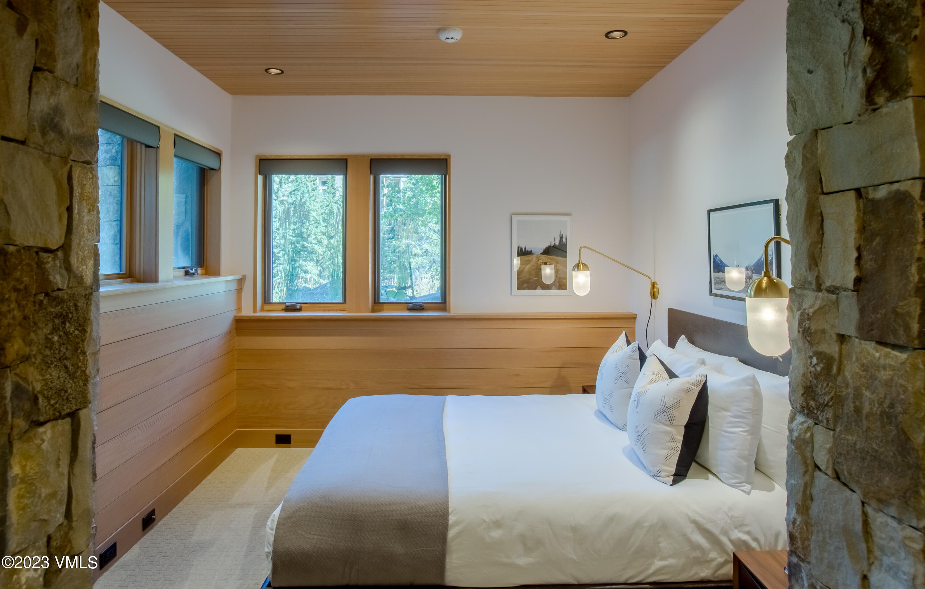 645 West Forest Road Vail, CO 81657 - Photo 30 of 48 a bedroom with a large bed and a couch