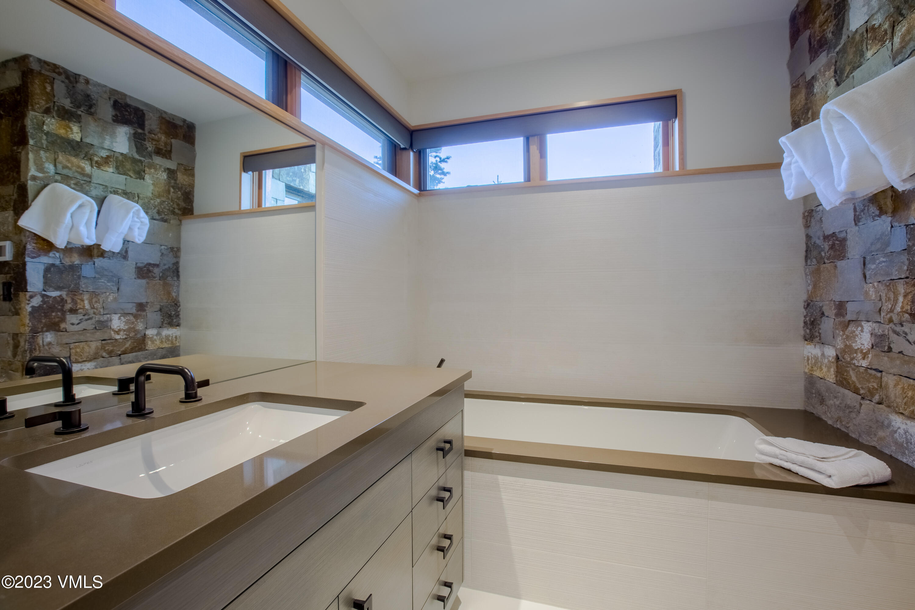 645 West Forest Road Vail, CO 81657 - Photo 32 of 48 a bathroom with a sink and a mirror