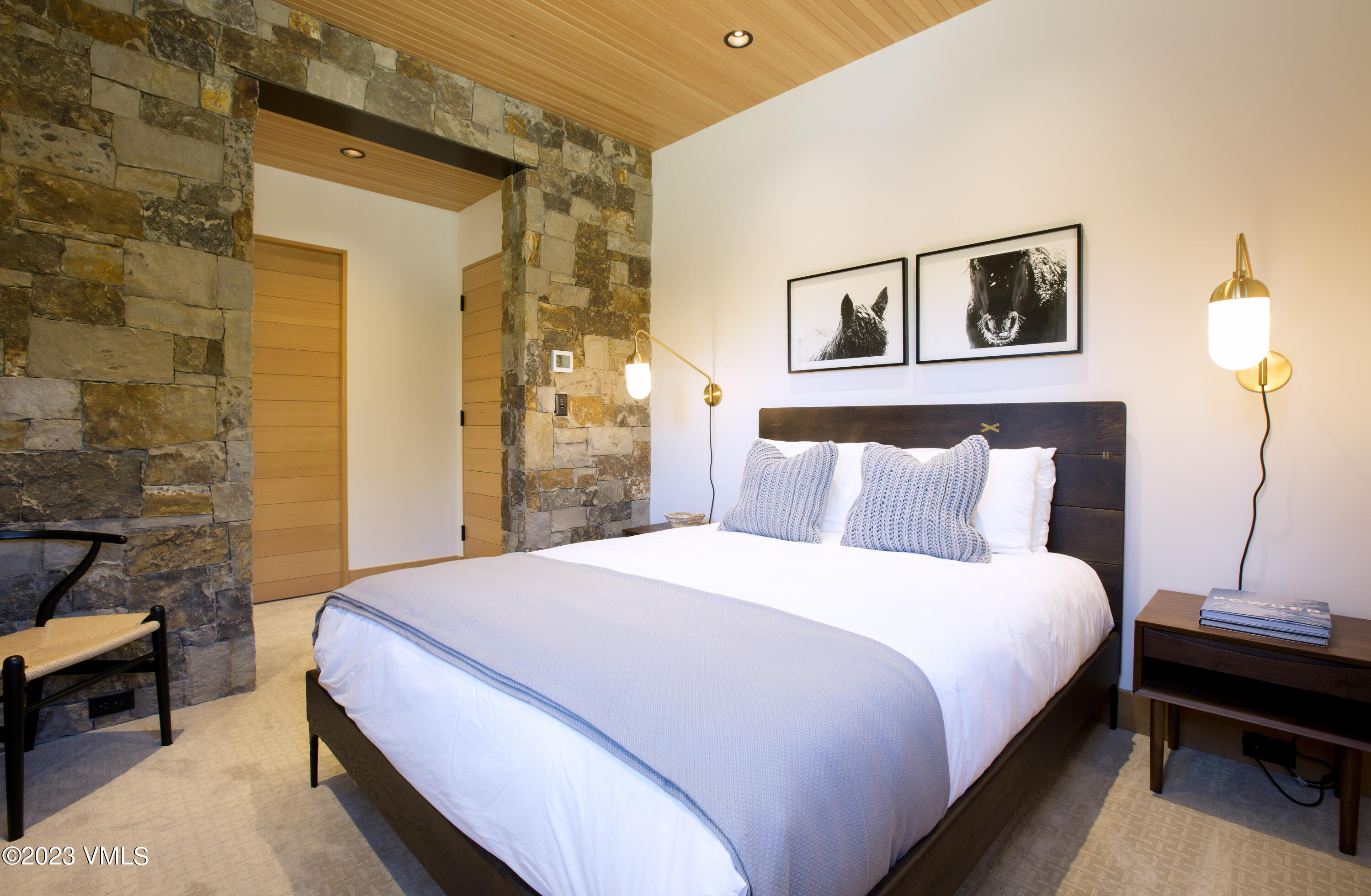 645 West Forest Road Vail, CO 81657 - Photo 34 of 48 a bedroom with a bed and a potted plant