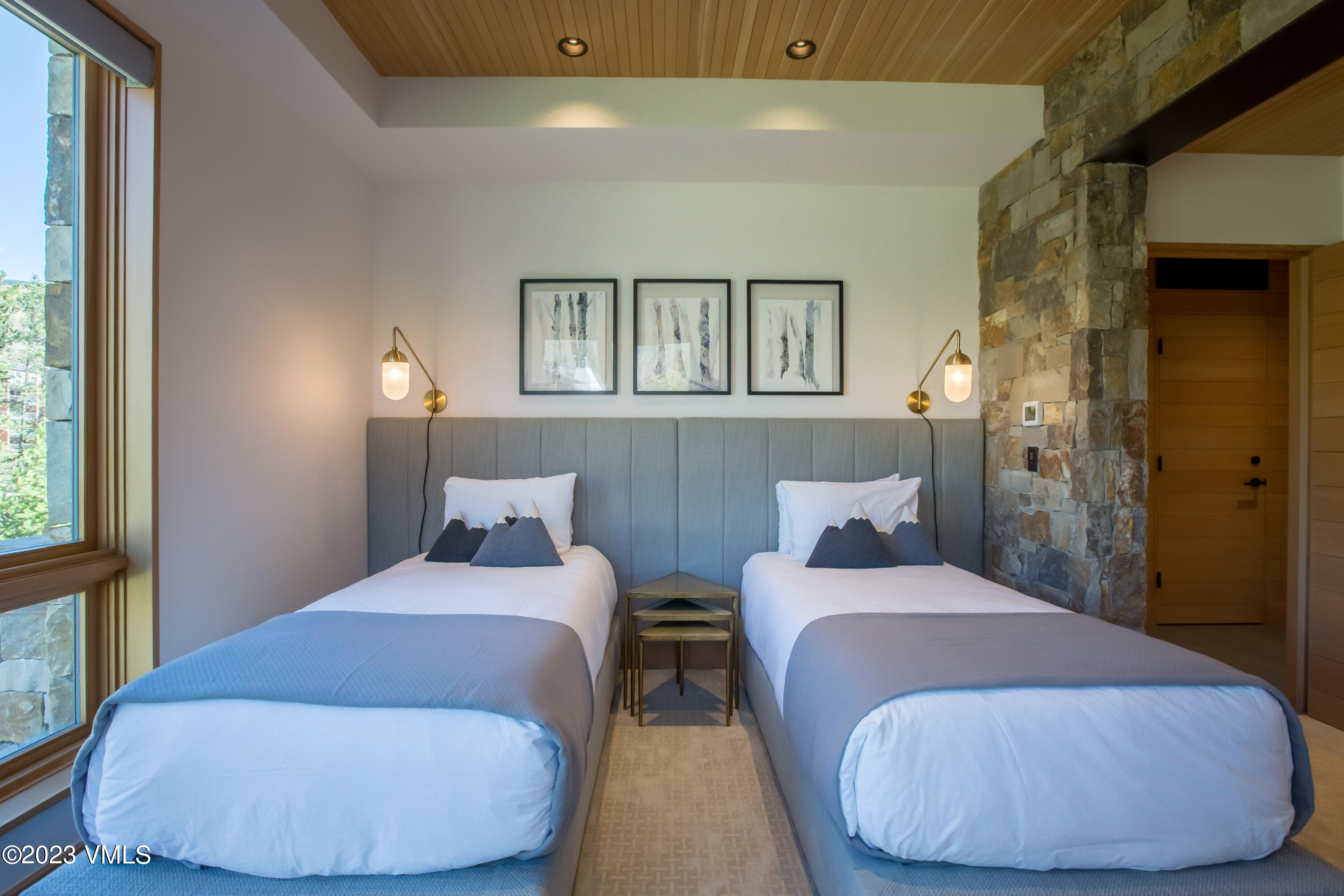 645 West Forest Road Vail, CO 81657 - Photo 37 of 48 a bedroom with two beds and a window