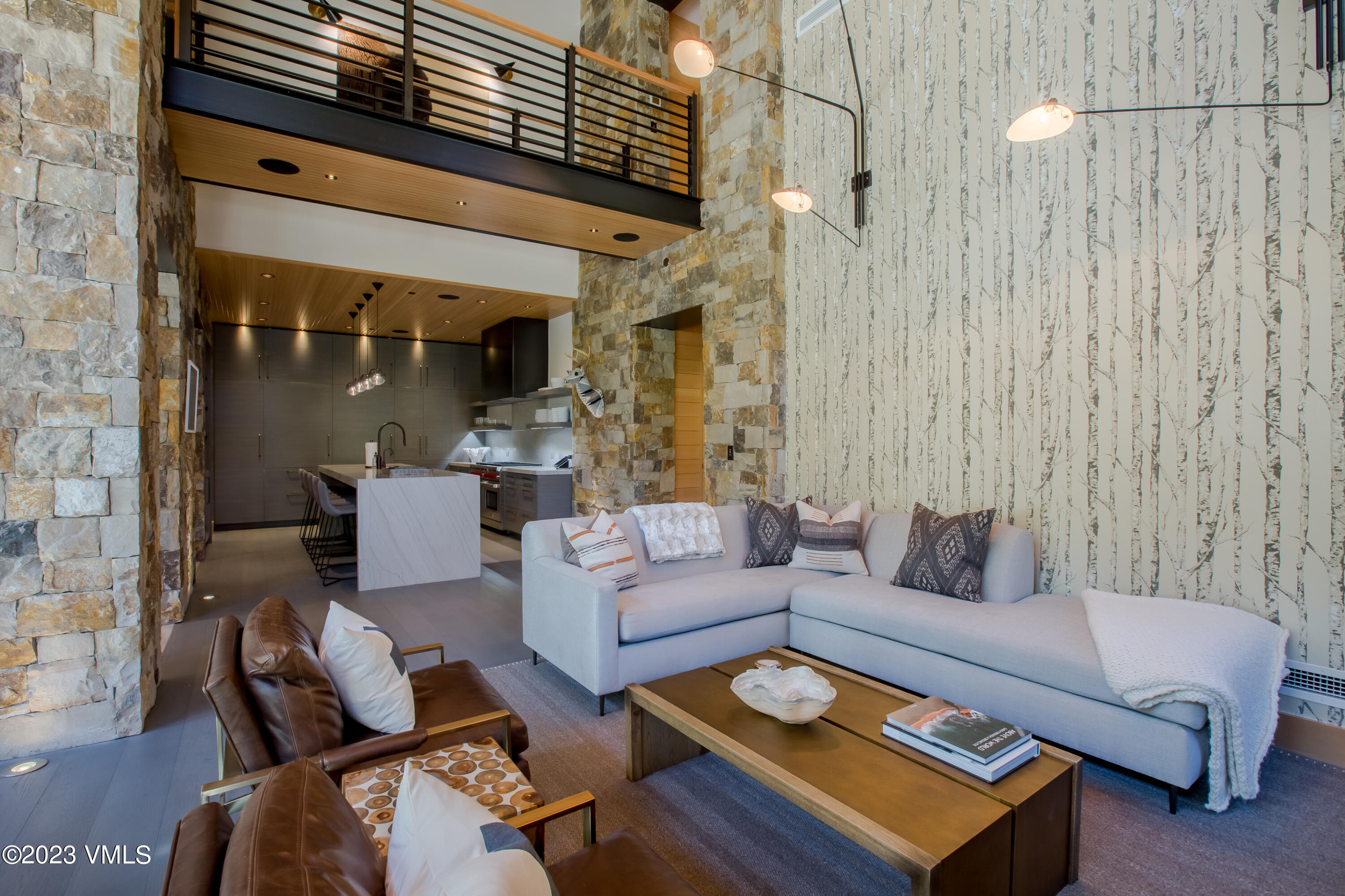 645 West Forest Road Vail, CO 81657 - Photo 4 of 48 a living room with furniture and a fireplace