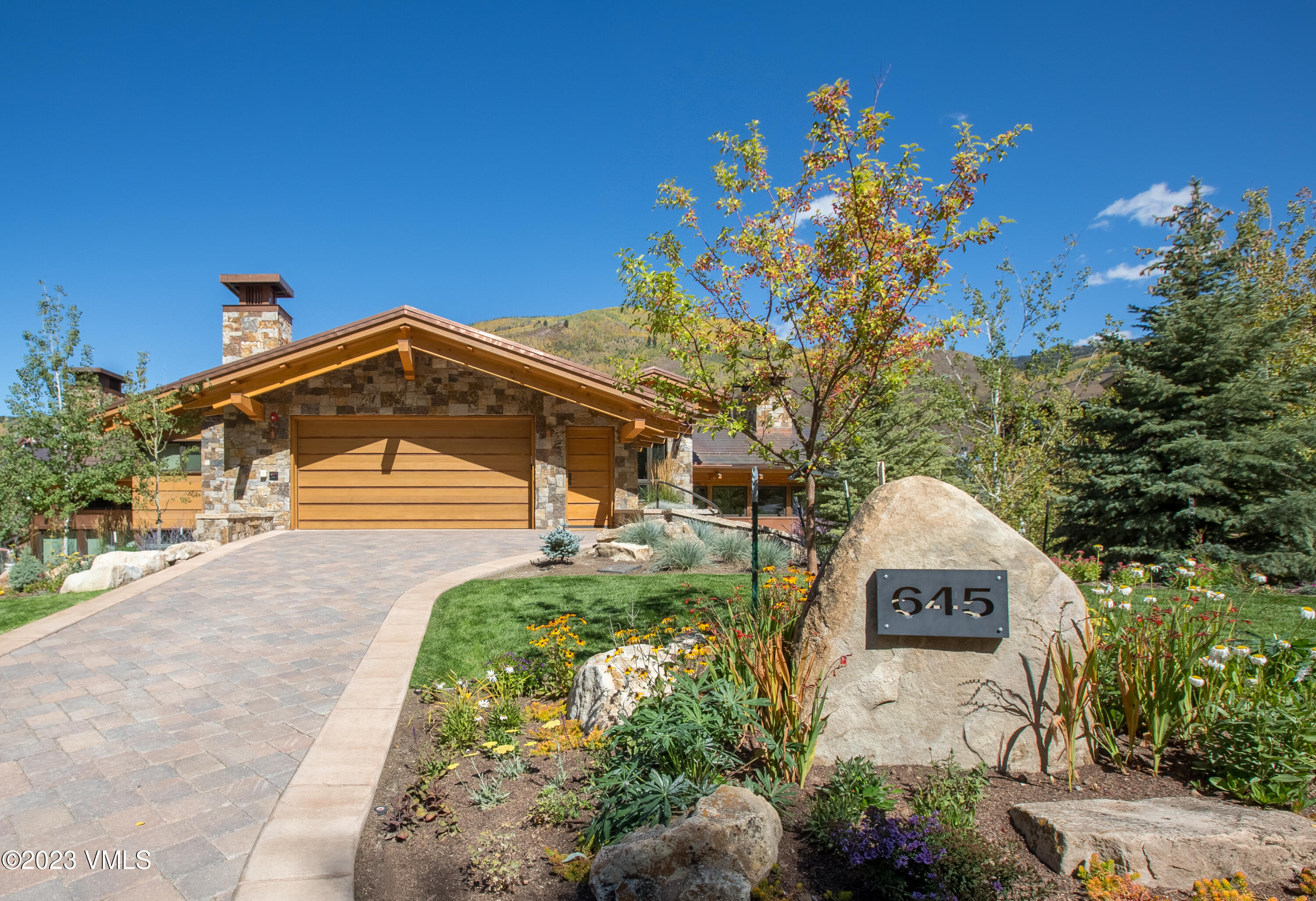 645 West Forest Road Vail, CO 81657 - Photo 43 of 48 a front view of a house with a yard