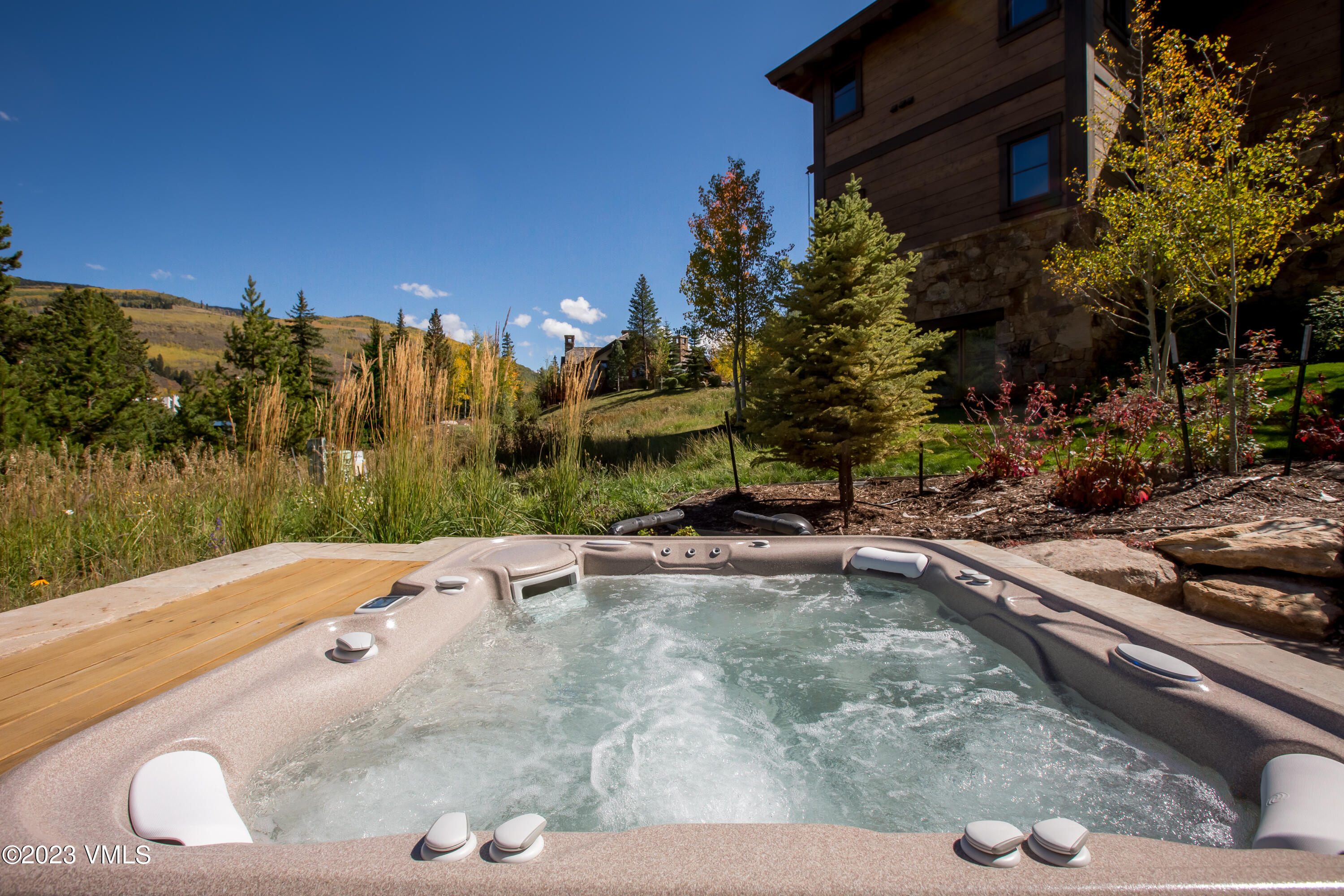 645 West Forest Road Vail, CO 81657 - Photo 47 of 48 a view of a swimming pool with a yard