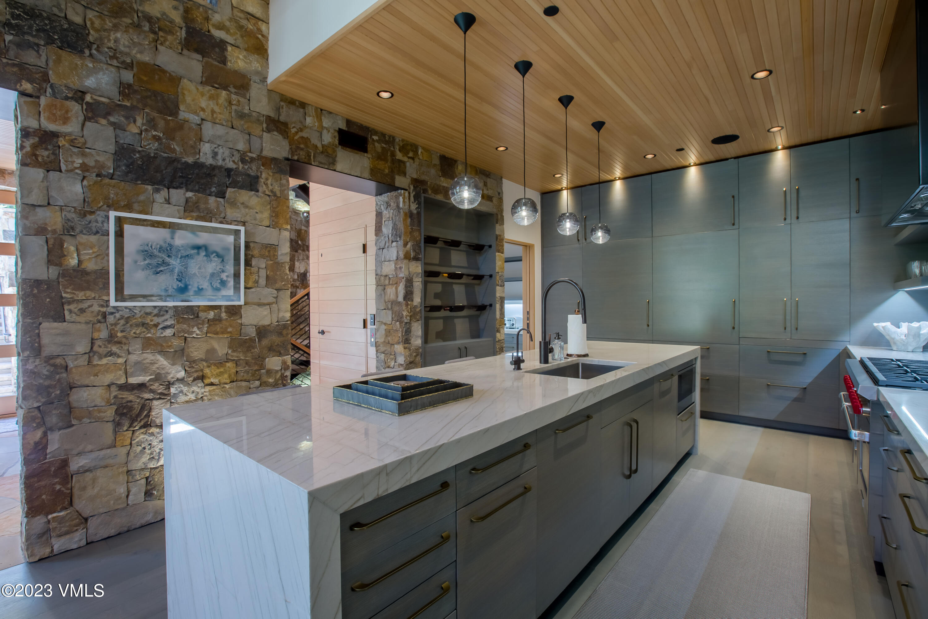645 West Forest Road Vail, CO 81657 - Photo 9 of 48 a kitchen with a sink and cabinets