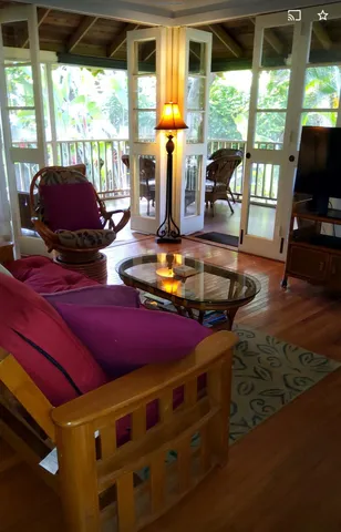 a room with furniture and large windows