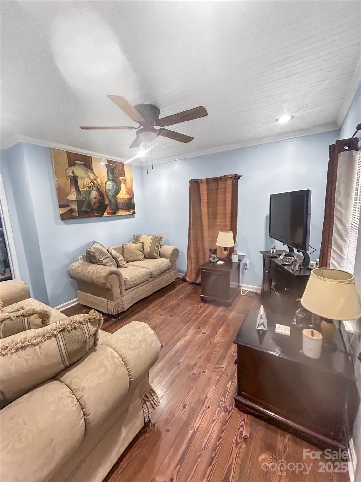 754 South 5th Street Albemarle, NC 28001 - Photo 4 of 13 a living room with furniture and a flat screen tv