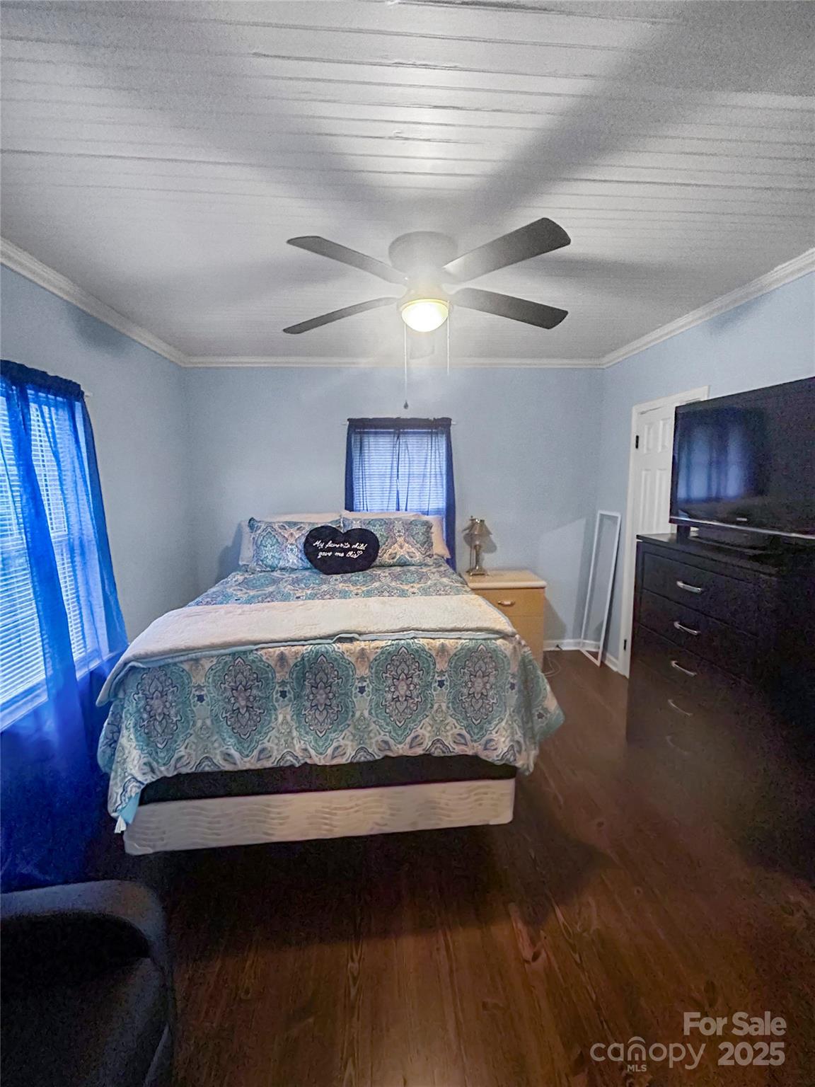 754 South 5th Street Albemarle, NC 28001 - Photo 10 of 13 a bedroom with a bed and wooden floor