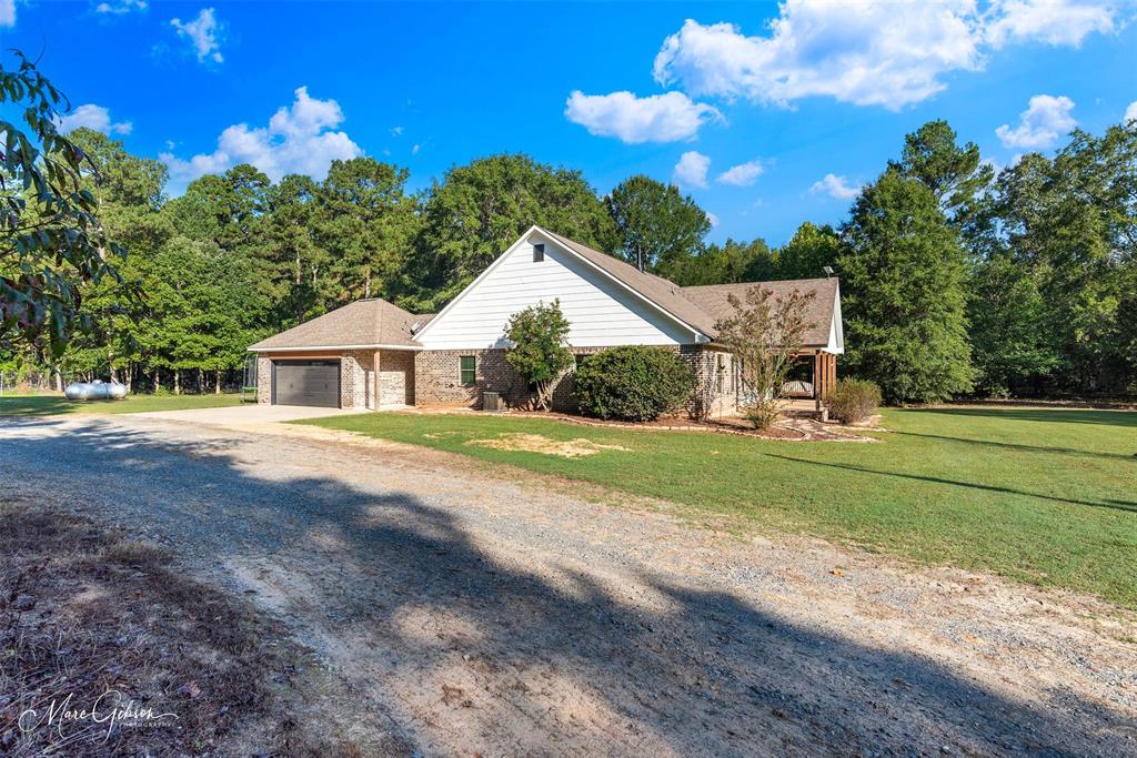 550 Linton Bellevue Road Benton, LA 71006 - Photo 5 of 37 View of property exterior with driveway and an attached garage
