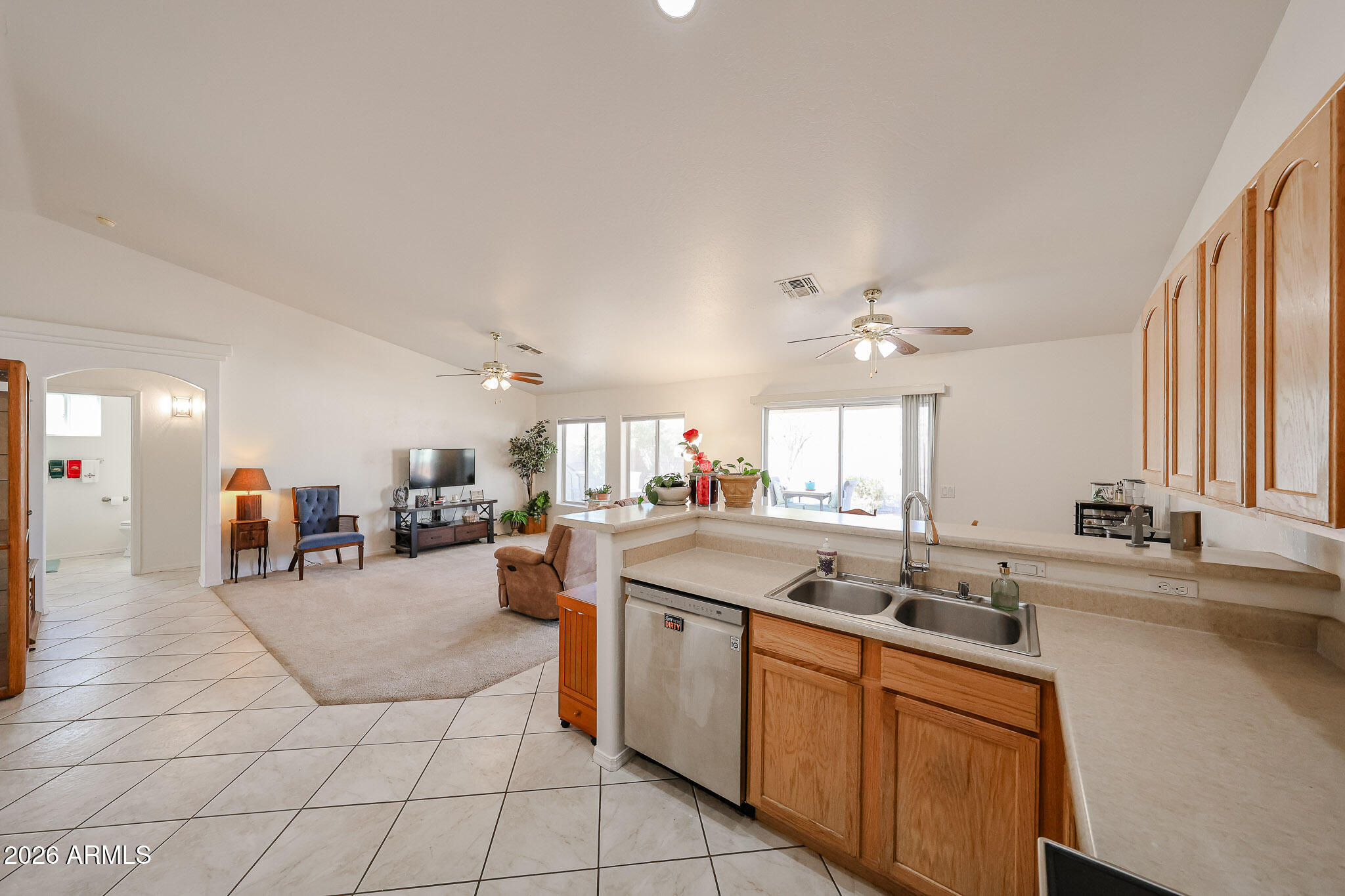 14980 South Capistrano Road Arizona City, AZ 85123 - Photo 12 of 39 a open kitchen with stainless steel appliances granite countertop a sink and cabinets