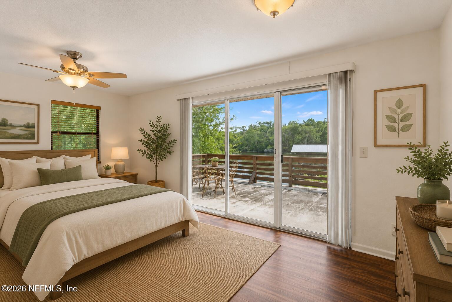 145 Finnigan Road Satsuma, FL 32189 - Photo 12 of 43 a bedroom with a balcony a bed and a window