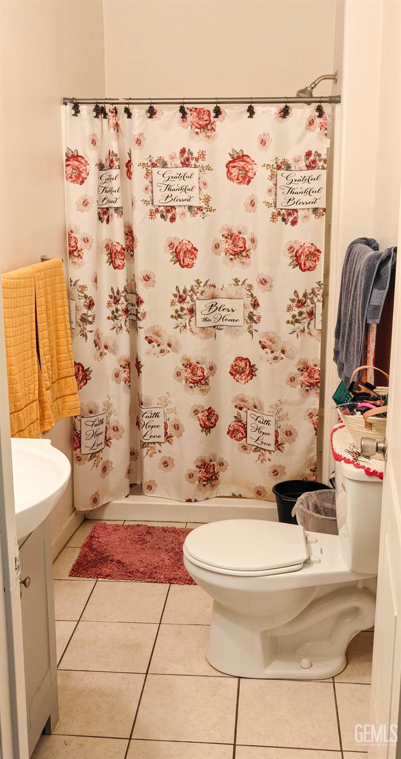 Undisclosed Address Visalia, CA 93291 - Photo 11 of 14 a bathroom with a sink toilet and shower