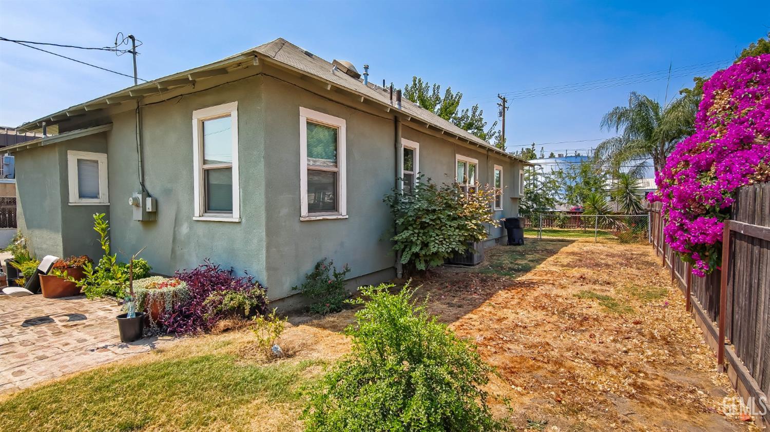 Undisclosed Address Visalia, CA 93291 - Photo 2 of 14 a front view of a house with a yard