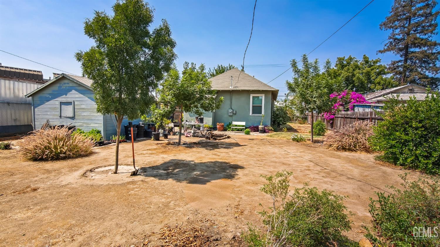 Undisclosed Address Visalia, CA 93291 - Photo 3 of 14 a front view of a house with a yard