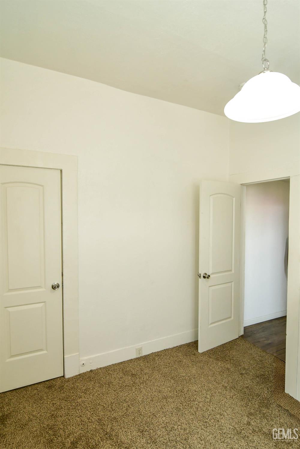 Undisclosed Address Visalia, CA 93291 - Photo 9 of 14 an empty room with a workbench