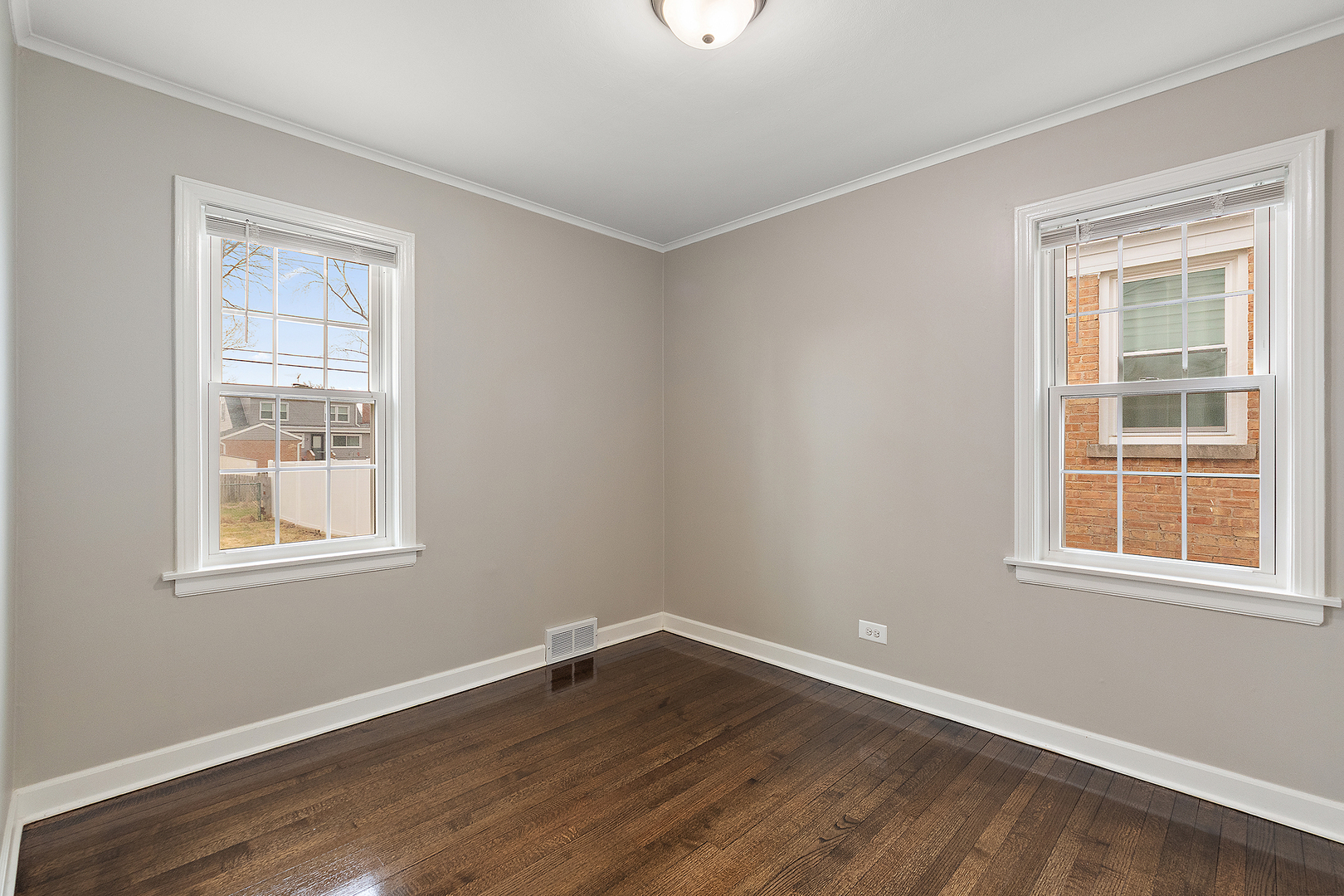 1521 North Wolf Road Berkeley, IL 60163 - Photo 11 of 16 a view of an empty room with wooden floor and a window