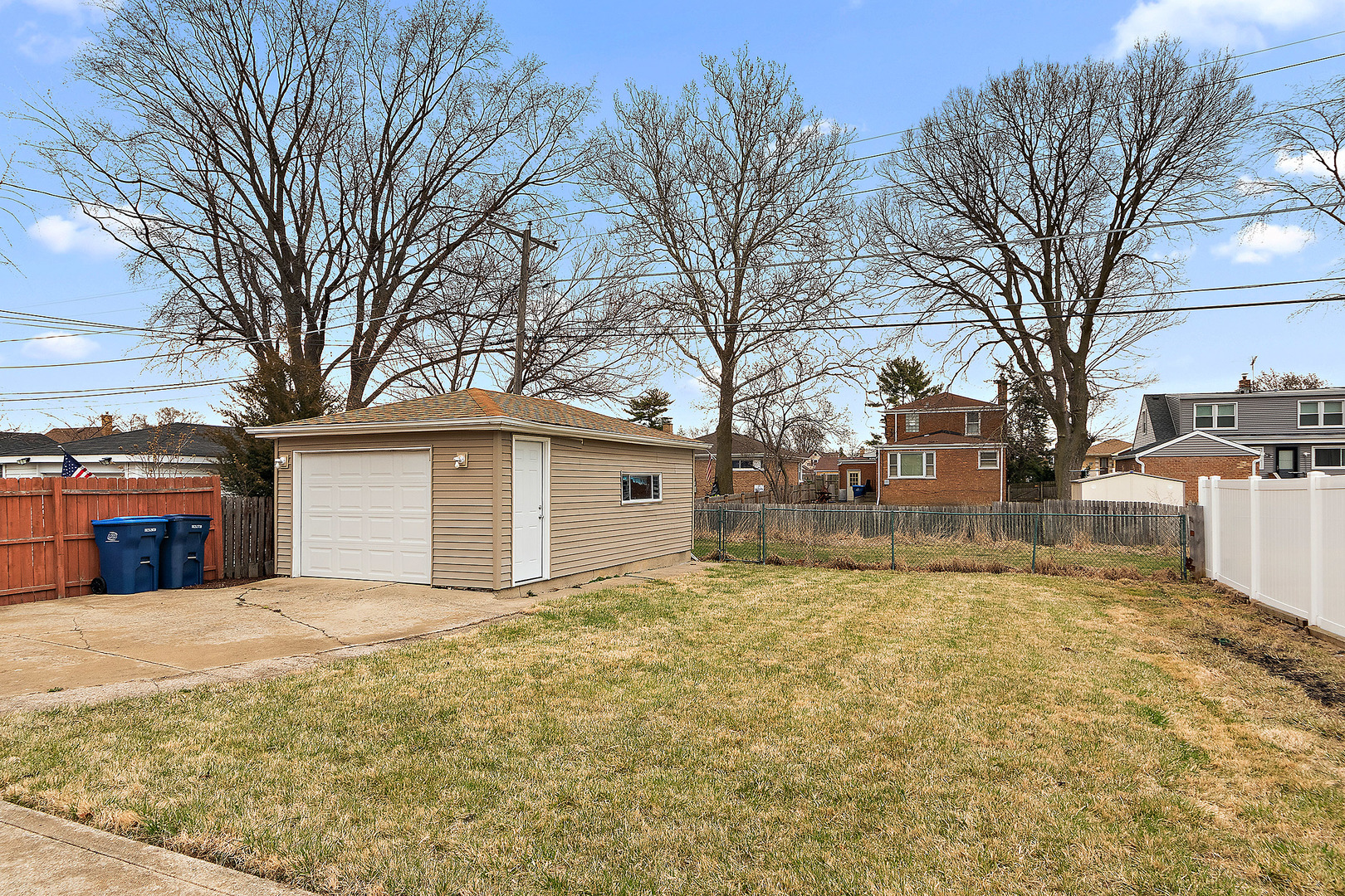 1521 North Wolf Road Berkeley, IL 60163 - Photo 14 of 16 a view of a house with a yard covered with snow