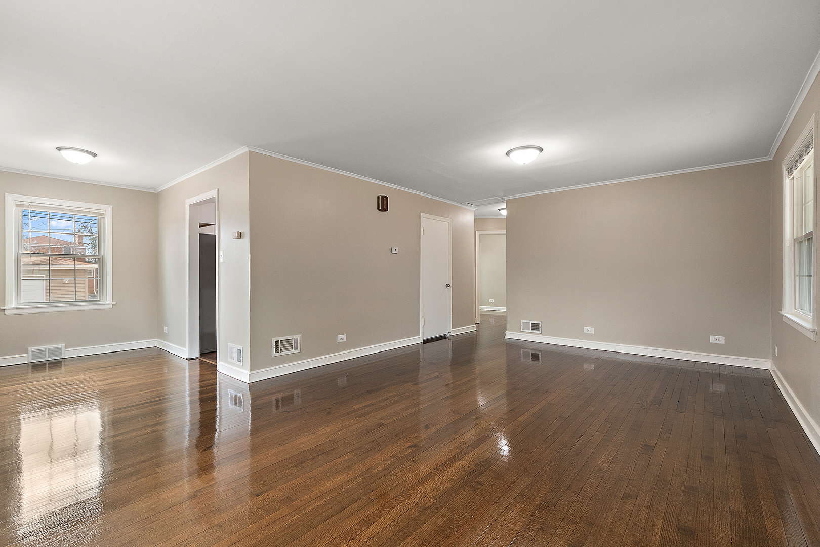 1521 North Wolf Road Berkeley, IL 60163 - Photo 5 of 16 an empty room with wooden floor and windows