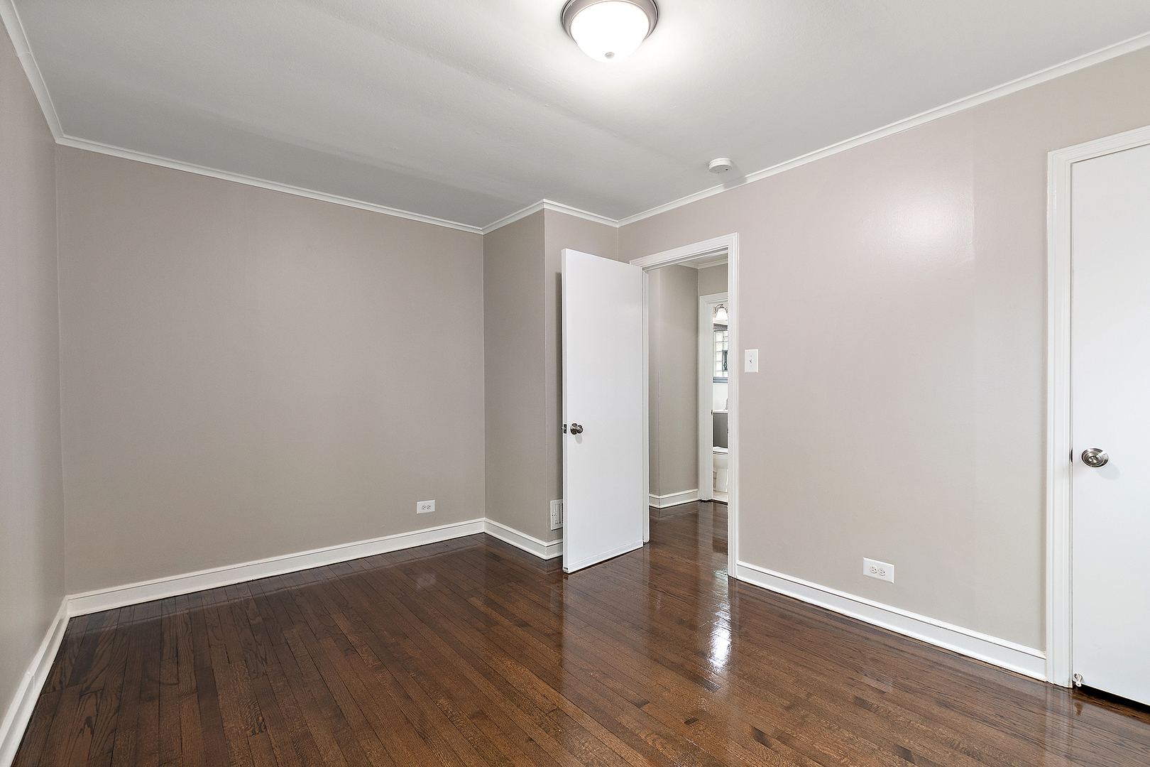 1521 North Wolf Road Berkeley, IL 60163 - Photo 10 of 16 a view of an empty room with wooden floor