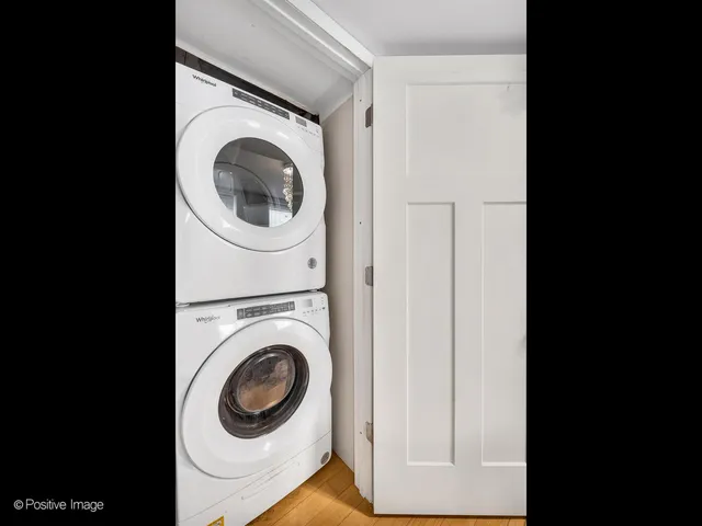 a view of a hallway with washer and dryer