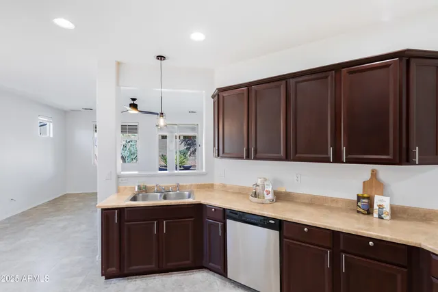 a bathroom with a granite countertop sink and a large mirror