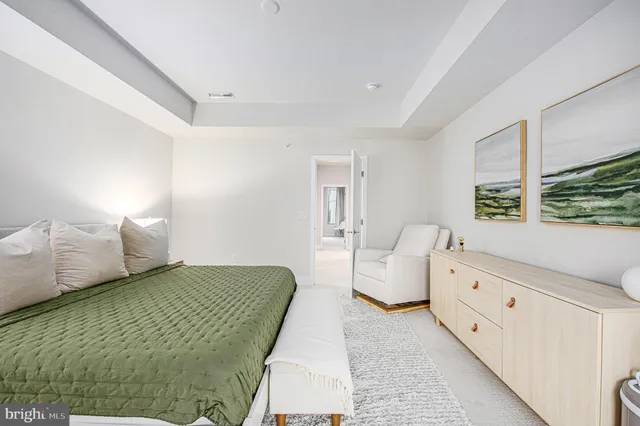 a bedroom with a bed and a cabinets