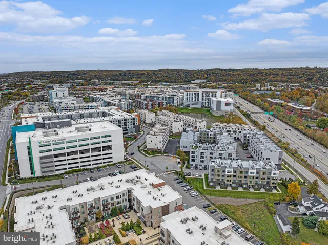 an aerial view of a multi story parking building