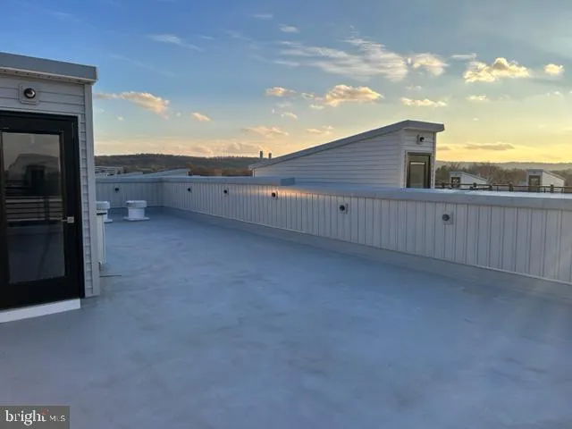 a picture of a bench in front of a building