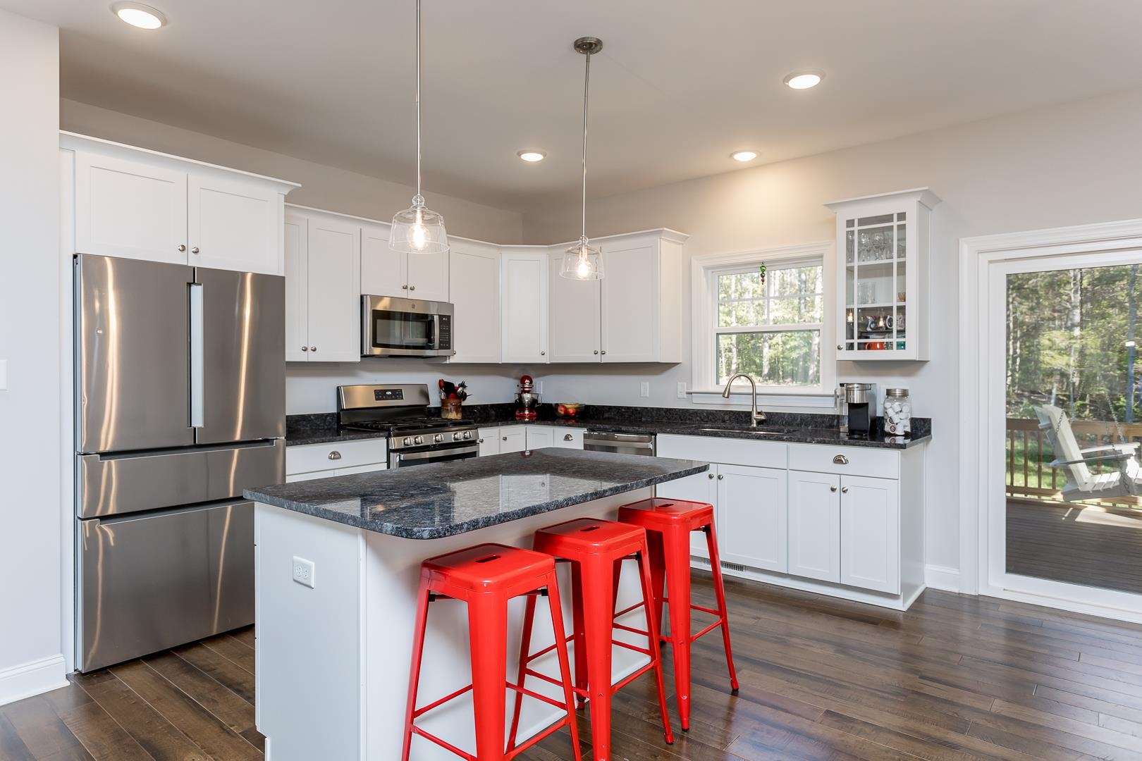 3768 Boundary Run Road Gum Spring, VA 23065 - Photo 13 of 46 a kitchen with stainless steel appliances granite countertop a refrigerator a sink dishwasher a stove and white countertops with wooden floor