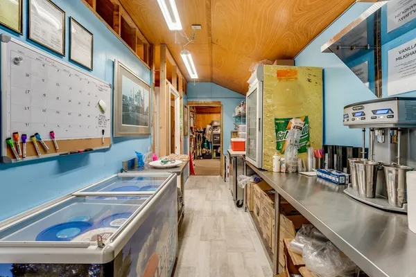 a room with storage and a view of living room