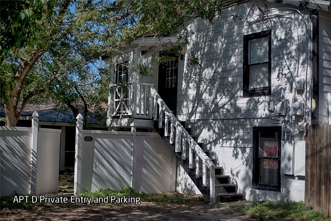 a view of a house with large tree