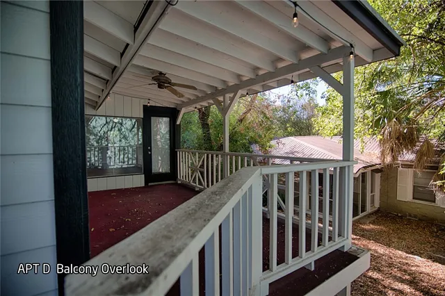 a view of balcony with wooden floor and outdoor seating