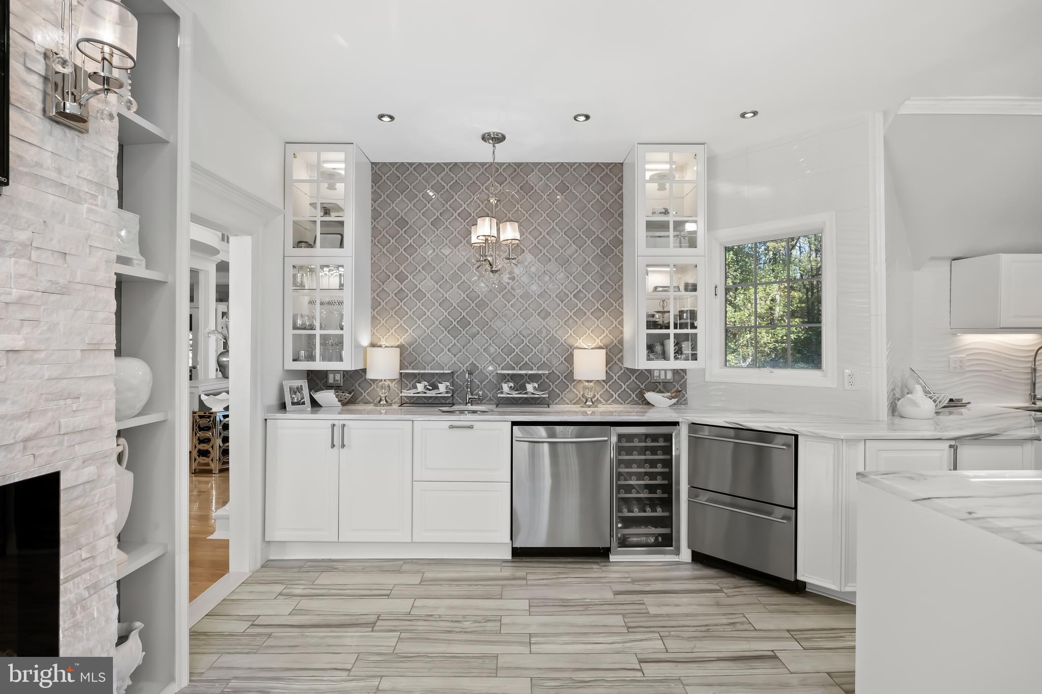 33 South Elmwood Road Marlton, NJ 08053 - Photo 25 of 98 a large kitchen with stainless steel appliances a large counter top a stove a chimney and a refrigerator