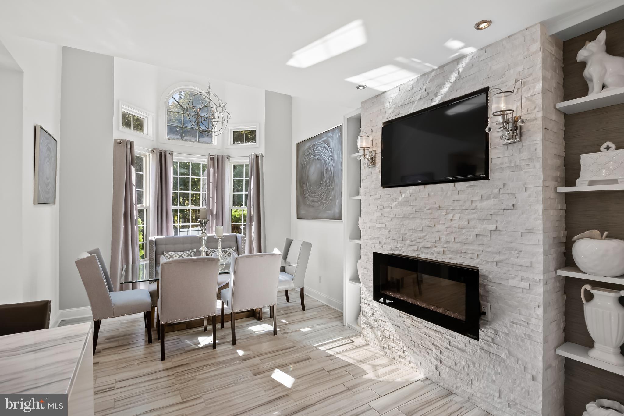 33 South Elmwood Road Marlton, NJ 08053 - Photo 26 of 98 a living room with furniture a fireplace and a flat screen tv